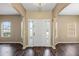 Bright foyer with hardwood floors, side-light windows and an elegant front door at 13216 Antelope St, Spring Hill, FL 34609
