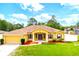 Beautiful single-Gathering home boasts a well-maintained lawn, attractive landscaping, and inviting curb appeal at 13216 Antelope St, Spring Hill, FL 34609