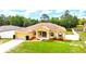 Well-kept single-Gathering home featuring attractive landscaping and a lush green lawn at 13216 Antelope St, Spring Hill, FL 34609