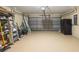 Spacious garage with ample storage, painted floor and overhead door system at 13216 Antelope St, Spring Hill, FL 34609