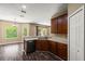 Kitchen with stainless steel appliances, wood cabinets, and a breakfast bar at 13216 Antelope St, Spring Hill, FL 34609