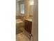 Bathroom features a soaking tub, granite vanity, and neutral-toned tile at 13752 Tensaw Dr, Hudson, FL 34669