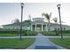 Attractive community clubhouse with manicured landscaping, offering residents a social gathering space at 13752 Tensaw Dr, Hudson, FL 34669