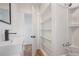 Bathroom with white fixtures, including a sink, toilet, and shower/tub combination at 1527 E Lake Ave, Tampa, FL 33610