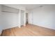 Bedroom featuring a bright interior with built-in closet and wood flooring at 1527 E Lake Ave, Tampa, FL 33610