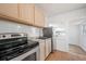 Bright kitchen featuring granite countertops and stainless steel appliances at 1527 E Lake Ave, Tampa, FL 33610