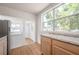 Cozy kitchen featuring wooden cabinets and lots of natural light at 1527 E Lake Ave, Tampa, FL 33610