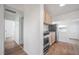 Bright kitchen with wooden cabinets and stainless steel appliances at 1527 E Lake Ave, Tampa, FL 33610