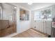 Utility area featuring a modern water heater and open access to kitchen at 1527 E Lake Ave, Tampa, FL 33610