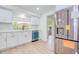 Updated kitchen with white cabinets, stainless steel appliances, and a window overlooking the backyard providing natural light at 2132 Sandpiper Dr, Clearwater, FL 33764