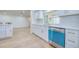 Bright kitchen with stainless steel appliances, white cabinets, and stylish backsplash at 2132 Sandpiper Dr, Clearwater, FL 33764
