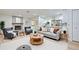 Inviting living room open to kitchen, with fireplace, modern decor, neutral tones creating an airy, comfortable atmosphere at 2132 Sandpiper Dr, Clearwater, FL 33764