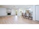 Open-concept living area with fireplace, breakfast bar, and modern decor at 2132 Sandpiper Dr, Clearwater, FL 33764