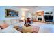 Cozy living room with fireplace, built-in shelving, and comfortable seating arrangement at 2132 Sandpiper Dr, Clearwater, FL 33764