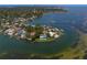 Breathtaking aerial view of the waterfront home on a private peninsula surrounded by water at 218 Colony Point S Rd, St Petersburg, FL 33705