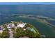 Aerial view showcases homes with waterfront access, private pools, and lush landscaping at 218 Colony Point S Rd, St Petersburg, FL 33705