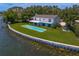 Beautiful backyard features a waterfront view, private pool and outdoor living space at 218 Colony Point S Rd, St Petersburg, FL 33705