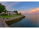 Large backyard of a waterfront home overlooking the seawall and the bay at 218 Colony Point S Rd, St Petersburg, FL 33705