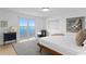 Bright bedroom with water views, modern decor, and a comfortable bed at 218 Colony Point S Rd, St Petersburg, FL 33705