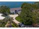 Beautiful home with pristine landscaping, circular driveway, and mature trees at 218 Colony Point S Rd, St Petersburg, FL 33705