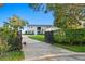 Beautiful waterfront property with large home and driveway, mature landscaping and secure gate at 218 Colony Point S Rd, St Petersburg, FL 33705