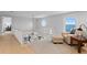Bright upstairs hallway with a sitting area, a reading nook, and a view of the water at 218 Colony Point S Rd, St Petersburg, FL 33705