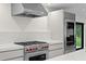 Gourmet kitchen features high-end stainless steel appliances, quartz counters and a large gas range at 218 Colony Point S Rd, St Petersburg, FL 33705