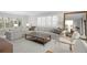 Bright and elegant living room with comfortable seating, natural light, and stylish decor and large mirror at 218 Colony Point S Rd, St Petersburg, FL 33705