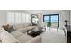 Bright and airy living room featuring comfortable seating, natural light, and stylish decor and water views at 218 Colony Point S Rd, St Petersburg, FL 33705