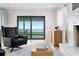 Inviting living room with a comfortable recliner and a bright view of the outdoors at 218 Colony Point S Rd, St Petersburg, FL 33705