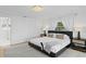 Well-lit main bedroom featuring stylish lamps and modern decor with easy access to bathroom at 218 Colony Point S Rd, St Petersburg, FL 33705