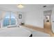Spacious main bedroom with light hardwood floors and direct access to outdoor ocean view at 218 Colony Point S Rd, St Petersburg, FL 33705