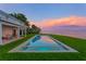 Stunning infinity pool overlooking the ocean and colorful sunset, perfect for relaxing and entertaining at 218 Colony Point S Rd, St Petersburg, FL 33705