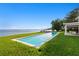 Beautiful backyard pool with view of the water and private dock at 218 Colony Point S Rd, St Petersburg, FL 33705