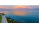 Calm waterfront view with clouds reflecting pink hues, enhancing the serene and picturesque open water at 218 Colony Point S Rd, St Petersburg, FL 33705