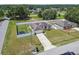Overhead shot showing home, fenced yard, landscaping, and long driveway at 27050 Anthony Ave, Brooksville, FL 34602