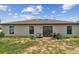 Exterior of home with patio area and ample backyard space for entertaining and relaxation at 27050 Anthony Ave, Brooksville, FL 34602