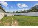 Spacious backyard with a white vinyl fence, perfect for entertaining or recreation at 27050 Anthony Ave, Brooksville, FL 34602