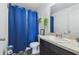 Bathroom featuring a shower, toilet, vanity, and hanging plants at 27050 Anthony Ave, Brooksville, FL 34602