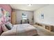 Cozy bedroom featuring a bed, desk, shelving unit, and a neutral color scheme at 27050 Anthony Ave, Brooksville, FL 34602