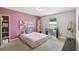 Bedroom featuring pink walls, a window, shelving, and carpeted floors at 27050 Anthony Ave, Brooksville, FL 34602
