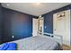 Blue bedroom featuring a single bed and a basketball hoop at 27050 Anthony Ave, Brooksville, FL 34602