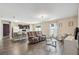 Open-concept living area with modern flooring and views into the kitchen at 27050 Anthony Ave, Brooksville, FL 34602