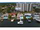 Waterfront homes with private docks and pools sit alongside a high-rise condo in this aerial view at 2773 Seabreeze S Dr, Gulfport, FL 33707