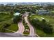 A captivating aerial view of the community showcasing lush landscaping, golf course, and waterfront homes at 2773 Seabreeze S Dr, Gulfport, FL 33707