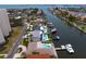 Scenic aerial view of a canal with waterfront homes, docks, and boats under clear skies at 2773 Seabreeze S Dr, Gulfport, FL 33707
