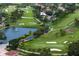 Aerial view of golf course community, showing mature trees, fairways, water features, and single-Gathering homes at 2773 Seabreeze S Dr, Gulfport, FL 33707