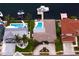 Aerial view showcasing an inviting backyard pool, accompanied by canal access and a private boat dock at 2773 Seabreeze S Dr, Gulfport, FL 33707
