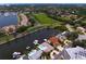Gorgeous aerial view of waterfront community with private boat docks, lush greenery, and pristine landscaping at 2773 Seabreeze S Dr, Gulfport, FL 33707