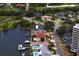 Stunning aerial view of waterfront homes with private docks, lush landscaping, and access to the bay and golf course at 2773 Seabreeze S Dr, Gulfport, FL 33707